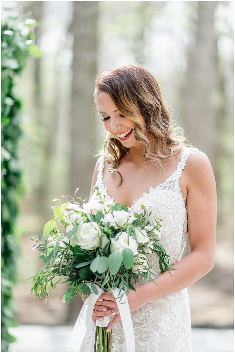 greenery and white bridal bouquet, lace bridal gown