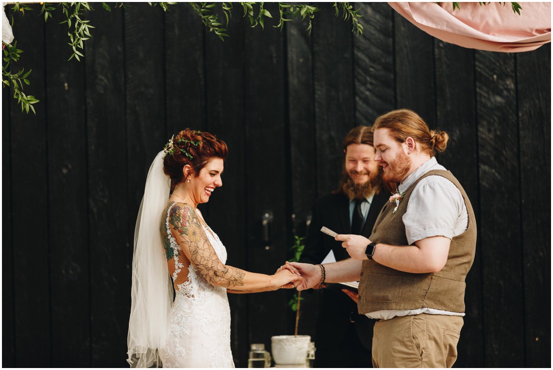 Tatted bride, groom with a man bun, and a black backdrop at the Whitebarn at Middlespring. |Eastern Shore Wedding|