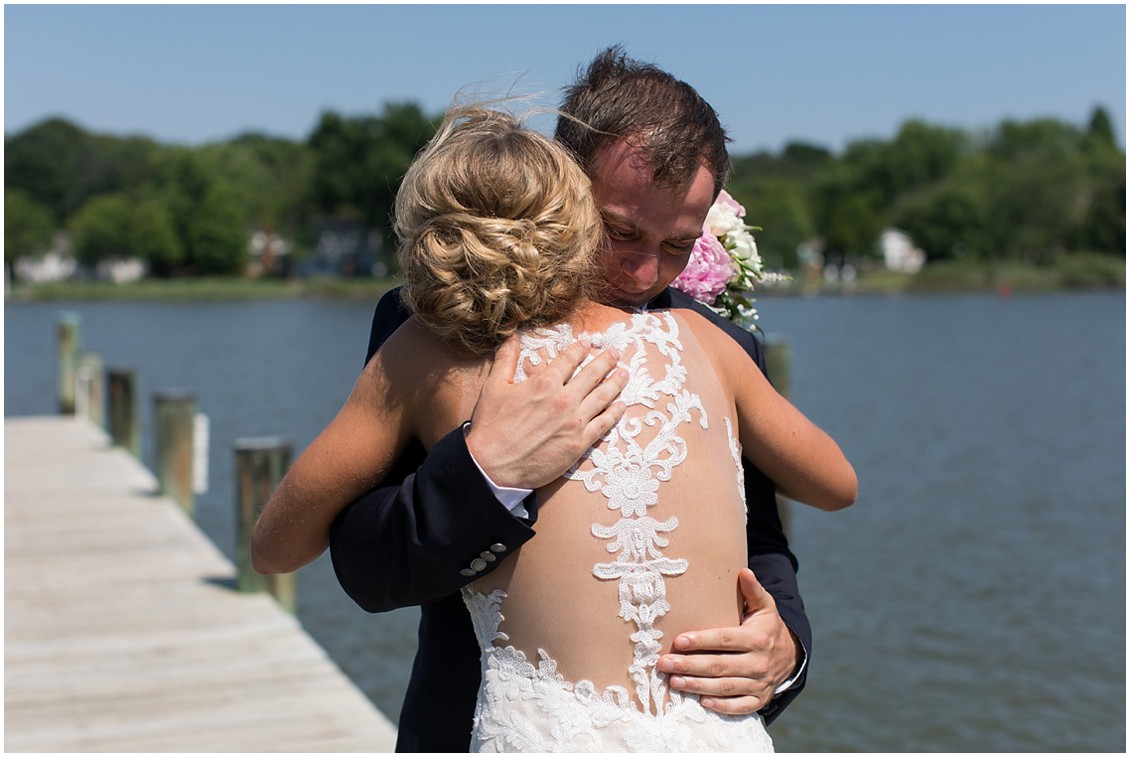 Bride and groom embracing on the dock at the Historic Kent Manor Inn. | My Eastern Shore Wedding | 