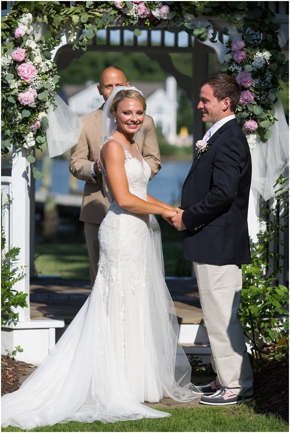 Bride and groom at the wedding altar, clasping hands. | My Eastern Shore Wedding | 