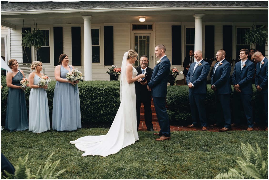 Rainy wedding ceremony in front of a white house. | My Eastern Shore Wedding | 