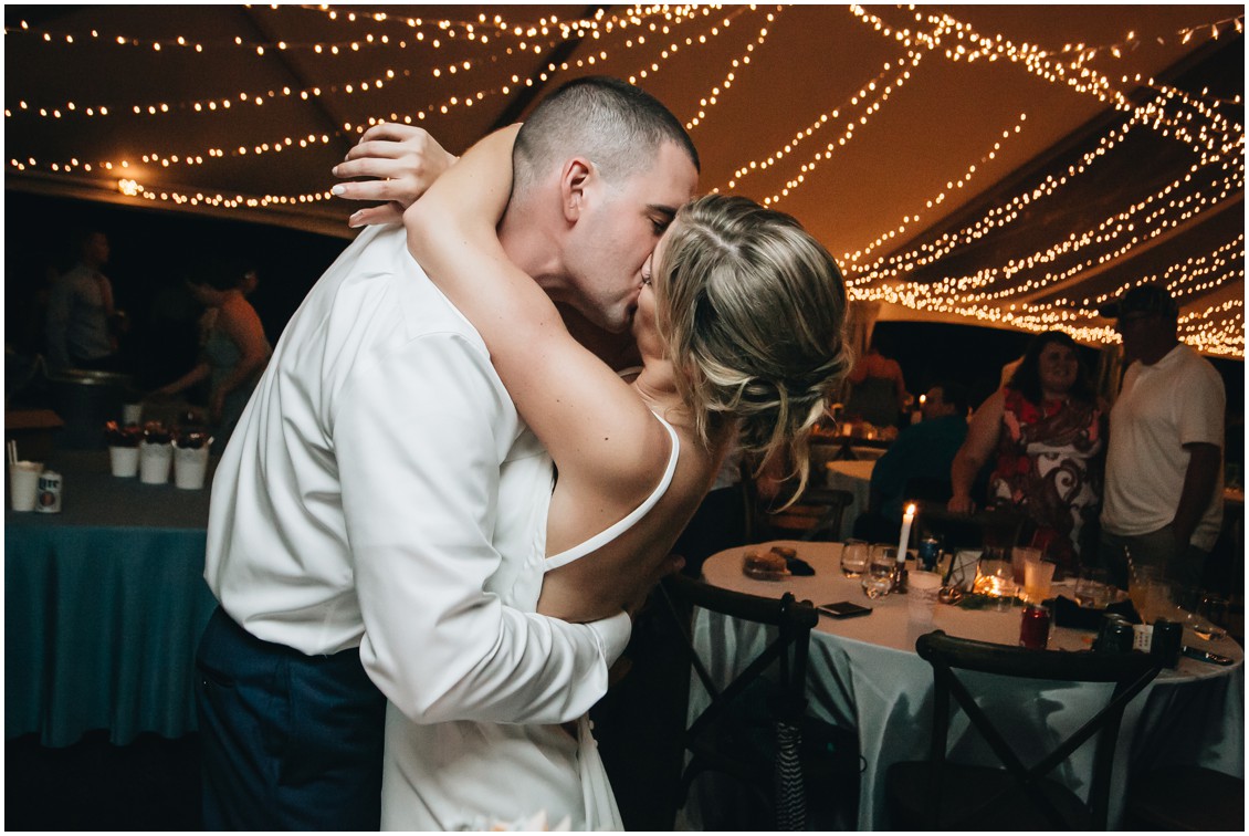Bride and groom kissing at wedding reception. | My Eastern Shore Wedding | 