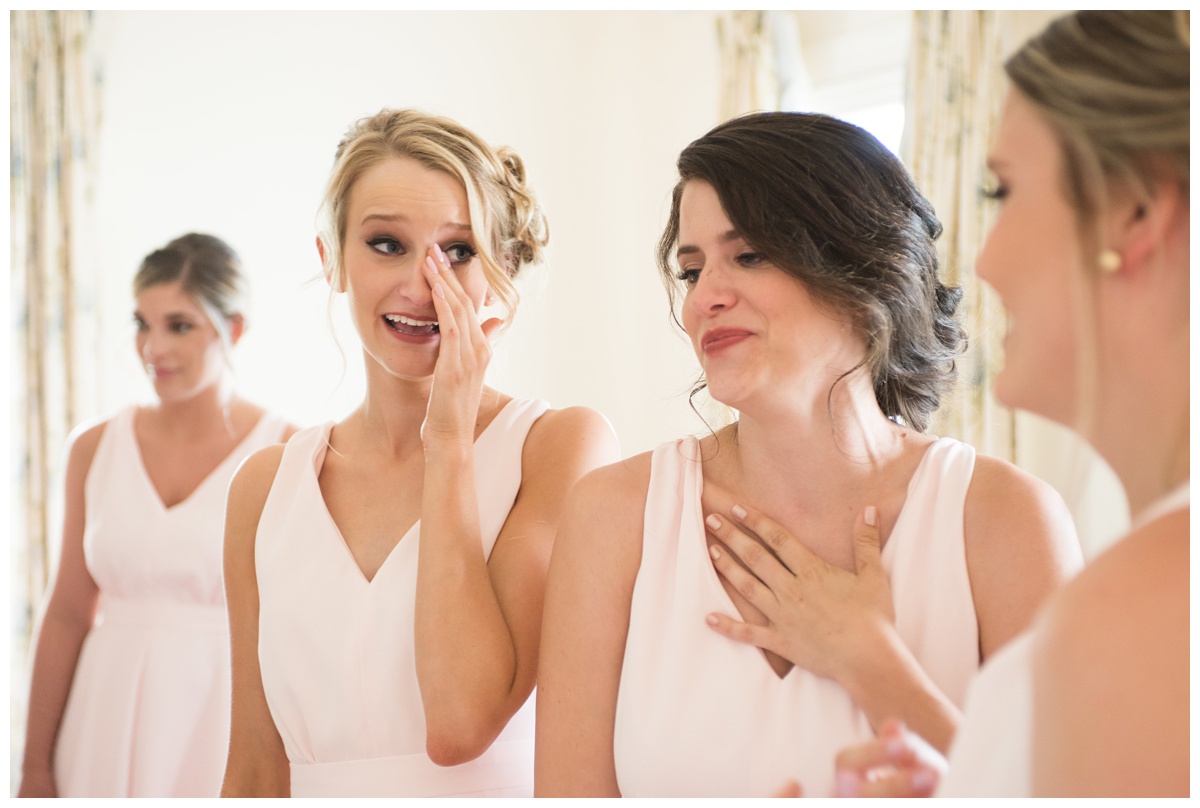 bridesmaids crying during getting ready photo at the oaks waterfront inn wedding day in june - the summer - at chesapeake bay wedding venue - waterfront wedding on the eastern shore