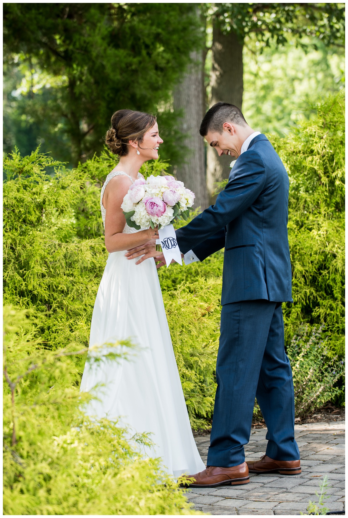 charming countryside wedding at the oaks waterfront inn - royal oak maryland venue - first look photo outdoors - smiling couple - chesapeake bay wedding - easton - st. michaels area wedding ideas in the summer