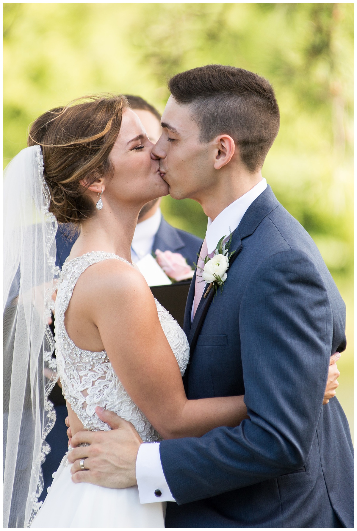 first kiss - just married photo - outdoors at chesapeake bay wedding on maryland eastern shore in the summer in june at the oaks waterfront inn - perfectly charming wedding inspiration | My Eastern Shore Wedding