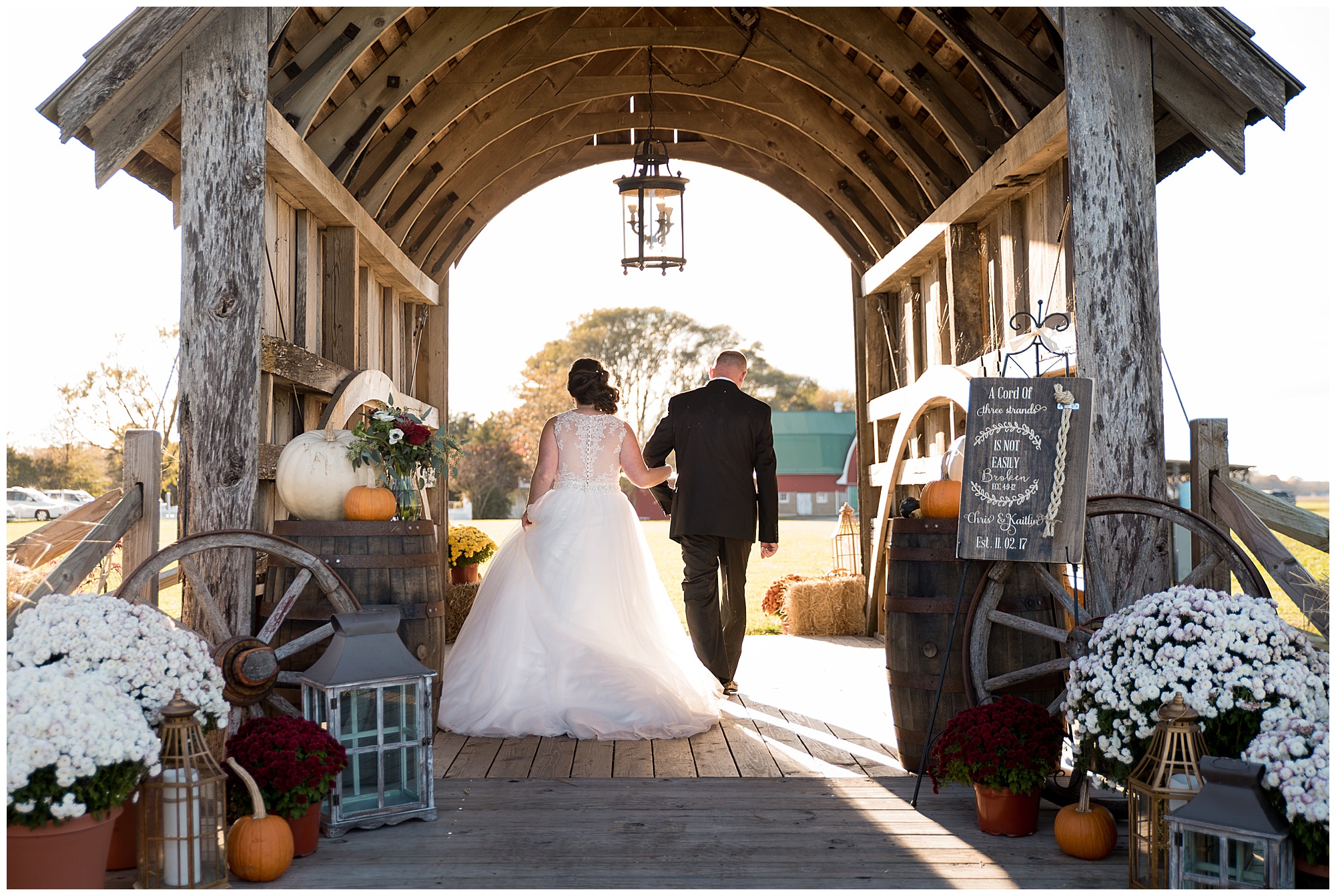 wedding photos outdoors at covered bridge inn in lewes delaware. historic wedding barn venue on the eastern shore. fall wedding in november with rustic decor theme.