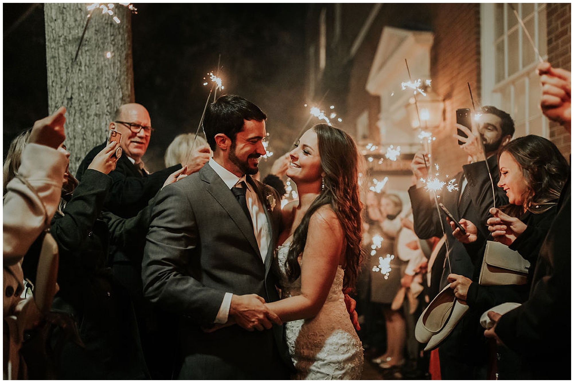 cue the confetti and fireworks for this autumn and fall wedding at the tidewater inn venue in easton maryland now featured on my eastern shore wedding. grand exit with sparklers at historic venue. intimate moody sultry romantic and totally classic.