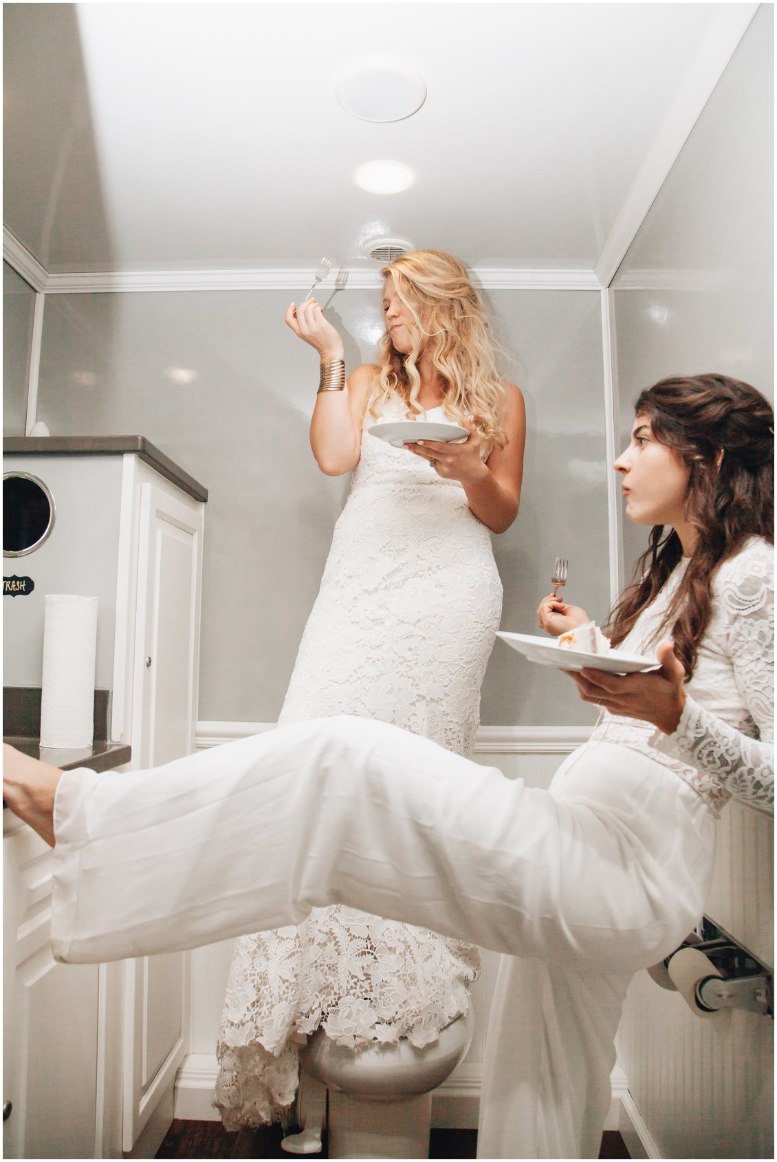 Brides eating cake in the bathroom | My Eastern Shore Wedding | Sherwood Florist | Cecile Storm Photography