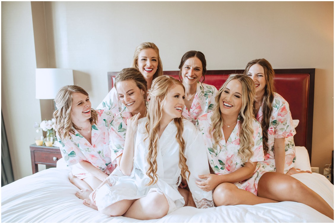 Bride and bridesmaids in matching robes getting ready | My Eastern Shore Wedding | Chesapeake Bay Beach Club