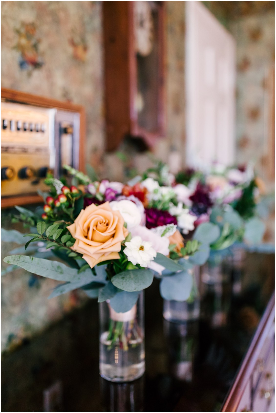 Bridal bouquets in detail, orange roses, dark red flowers, blush with eucalyptus | Kingsbay Mansion| My Eastern Shore Wedding