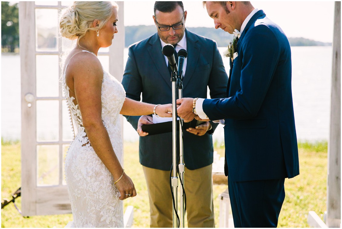 Bride and groom exchanging rings during outdoor ceremony | Kingsbay Mansion| My Eastern Shore Wedding