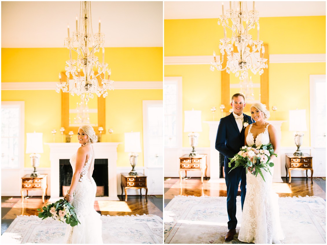 Bride and groom in yellow drawing room under crystal chandelier in historic mansion| Kingsbay Mansion| My Eastern Shore Wedding