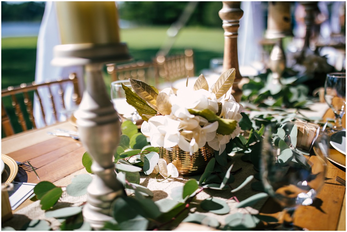 Details of farm tables with gold runners and lanterns, white flowers and greenery | Kingsbay Mansion| Dover Tents and Events |My Eastern Shore Wedding