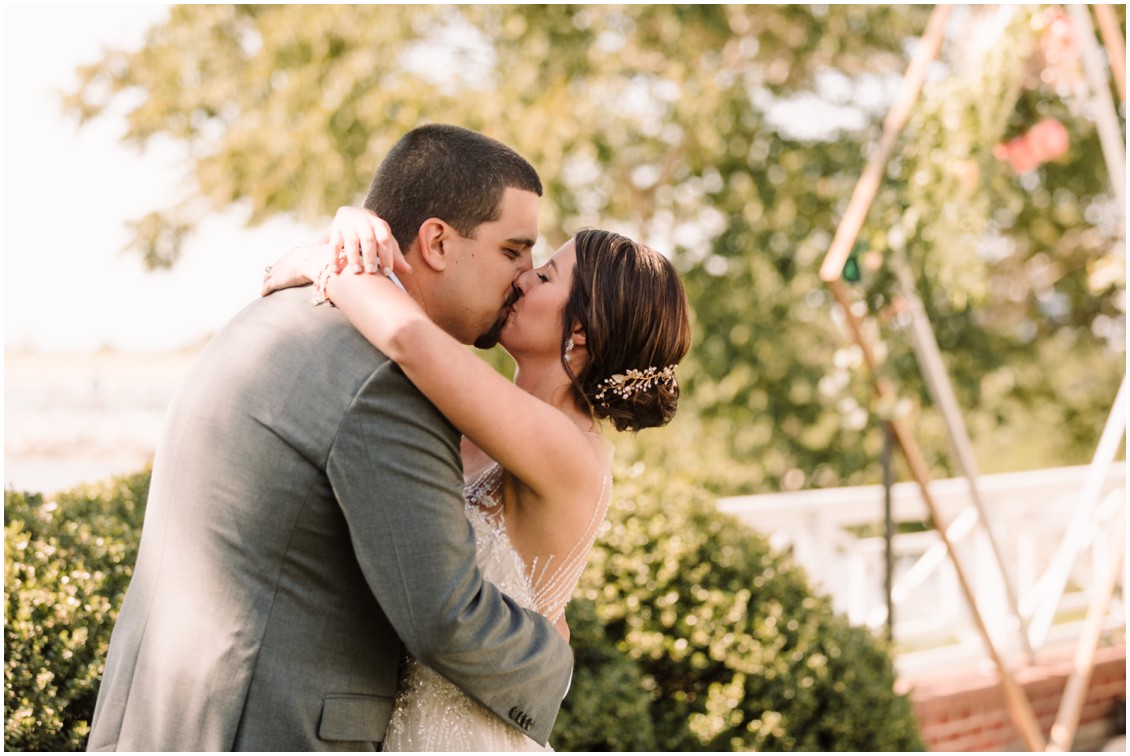 bride and groom kissing at bayside celebration | My Eastern Shore Wedding | Chesapeake Bay Beach Club