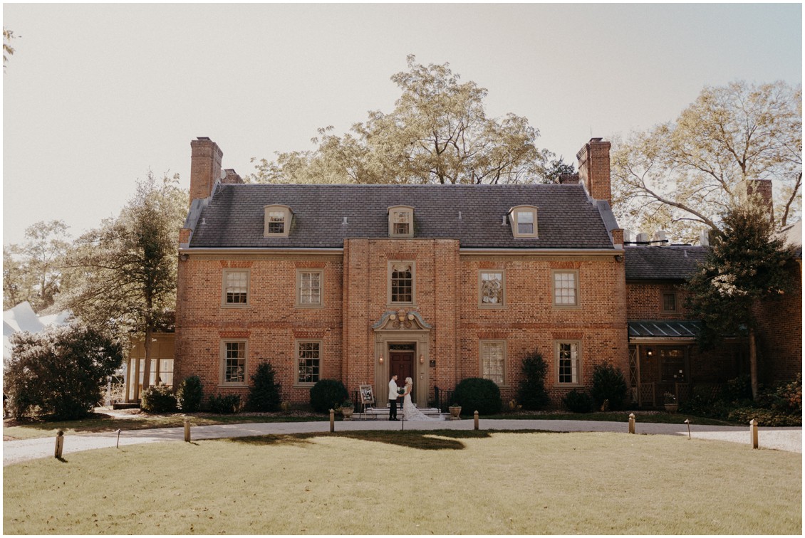 Bride and groom in front of grand manor house classic lux wedding | My Eastern Shore Wedding