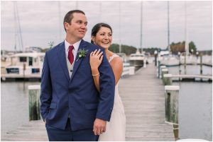 The bride embraces her new husband during a private moment on the pier at Osprey Point Inn. | My Eastern Shore Wedding | Laura's Focus Photography