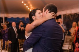 The newlywed couple embraces in a sweet kiss during their first dance. | My Eastern Shore Wedding | Laura's Focus Photography