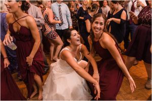 The bride dances with her wedding guests in fun celebration of her new marriage. | My Eastern Shore Wedding | Laura's Focus Photography