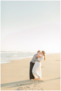 The couple embraces in a private romantic moment on the beach. | My Eastern Shore Wedding | Cassidy MR. Photography