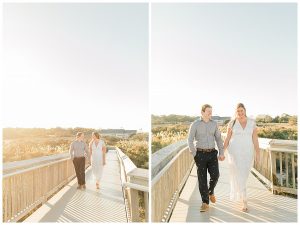 A dreamy scene of the engaged couple walking the boardwalk at Assateague Island National Seashore. | My Eastern Shore Wedding | Cassidy MR. Photography