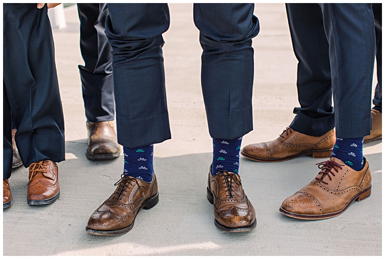 The groom and groomsmen wear wedding socks on the special day at the Hyatt Regency Chesapeake Bay | Laura's Focus Photography