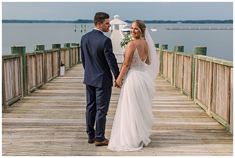 The couple enjoys a private walk on the dock at the Hyatt Regency Chesapeake Bay | Laura's Focus Photography