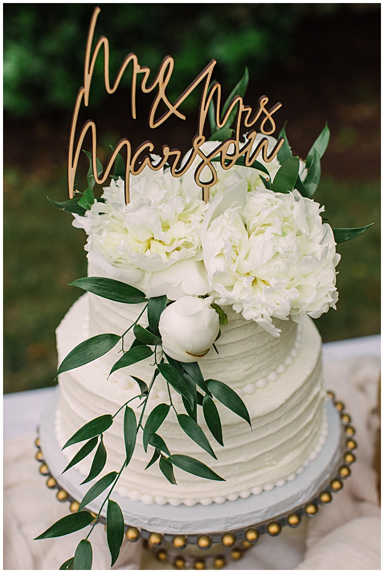A delicious cake topped with florals and a gold cake topper at the Hyatt Regency Chesapeake Bay | Laura's Focus Photography