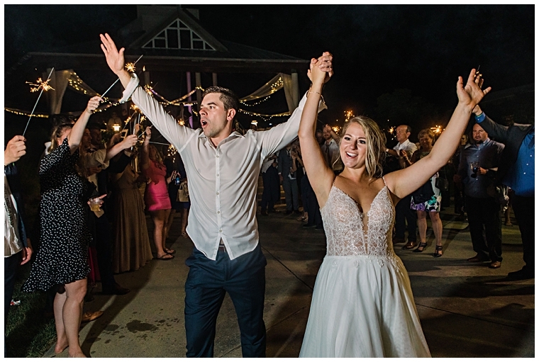 The bride and groom wave goodbye to their guests during their sparkler send off | Hyatt Regency Chesapeake Bay | Laura's Focus Photography