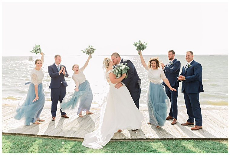 Bridal party celebrates the bride and groom. | Cassidy MR Photography