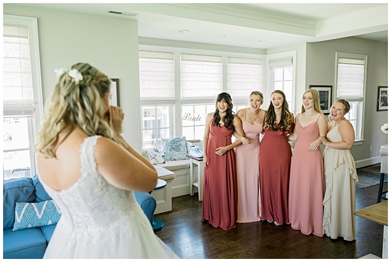 Bridesmaids enjoy a first look with the bride