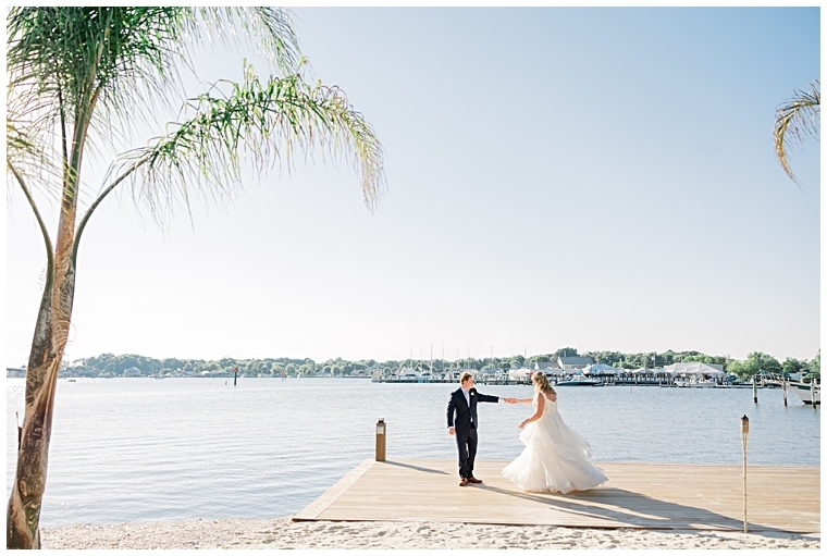 The bride and groom share a dance on the dock at their reception  | Inn at Haven Harbour 