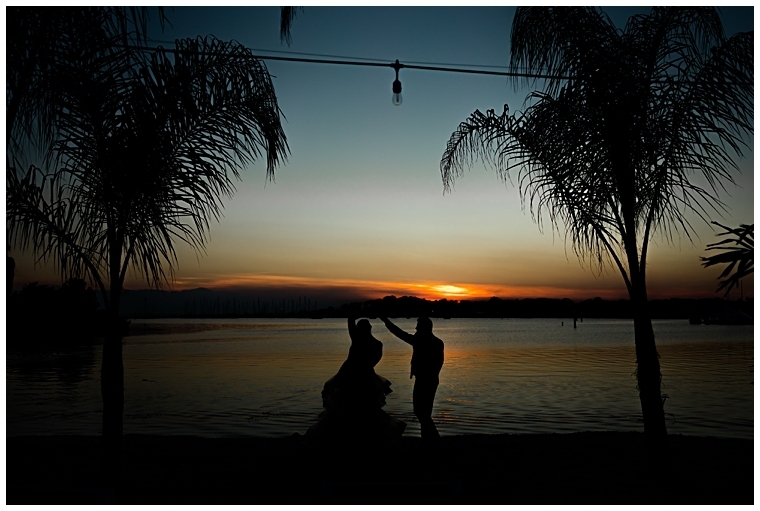 The newlyweds enjoy the sunset together on the beach outside the reception  | Inn at Haven Harbour 