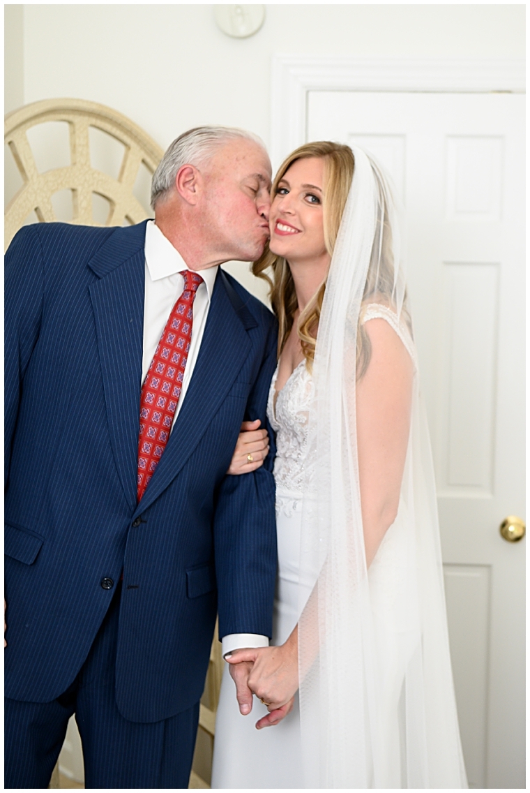 The father of the bride shares a special moment with his daughter before the wedding at The Oaks Waterfront Inn