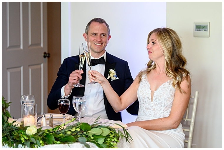 The newlyweds toast to their new marriage.