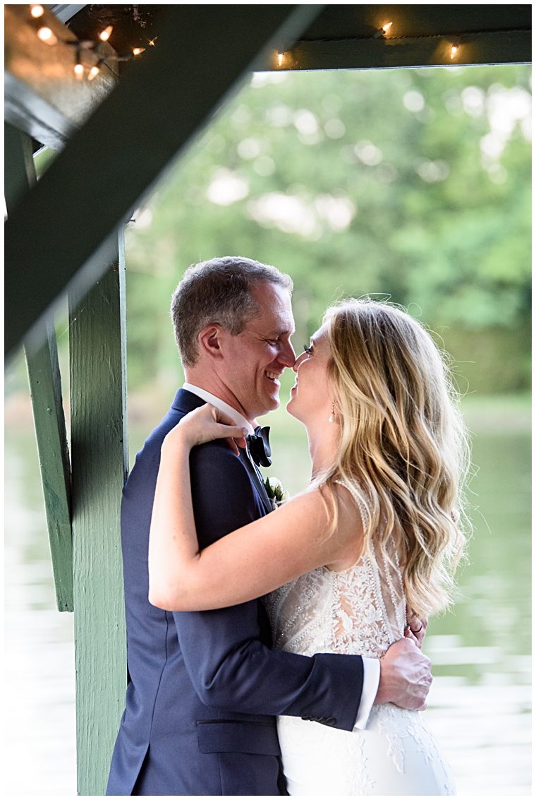 The newlyweds share a private moment on the dock at The Oaks Watefront Inn  | Kathy Blanchard Photography