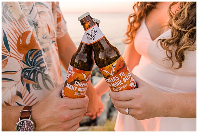 Cheers to the engagement! The future bride and groom toast to their upcoming marriage with a local brew by Flying Dog | Laura's Focus Photography