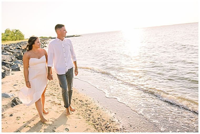 These college sweethearts enjoy the beautiful sunset views over the water at Claiborne Beach.