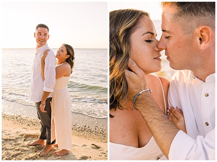 The couple shares an engagement kiss on the beach during sunset.
