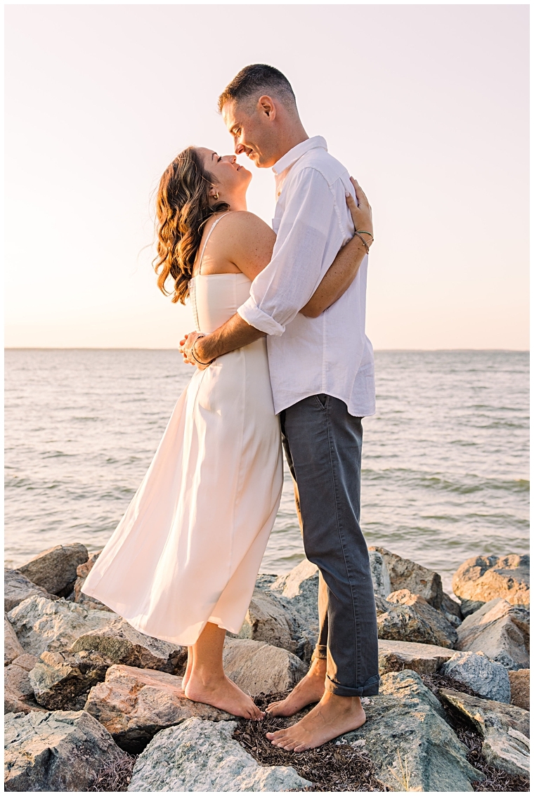 Standing on the jetty, Danielle and Tyler share a kiss during the sunset
