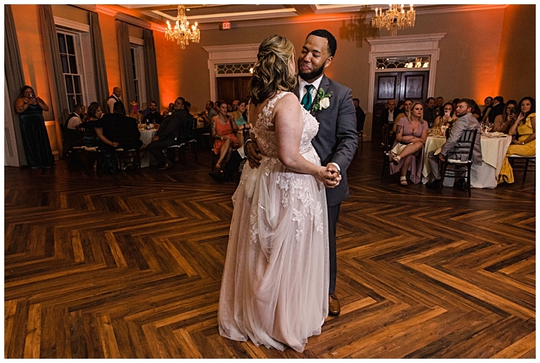 The newlyweds share their first dance as husband and wife in the ballroom at The Tidewater Inn