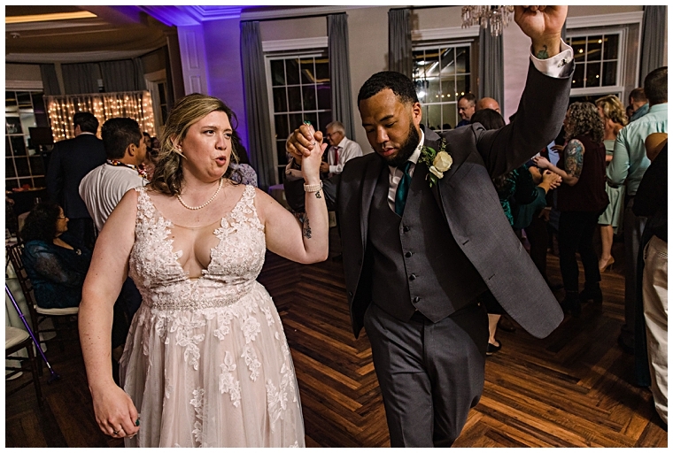 The bride and groom dance at their reception in the ballroom at The Tidewater Inn