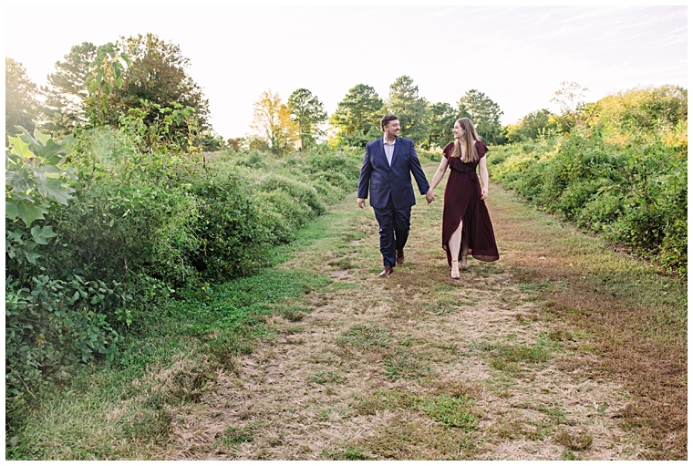 The soon to be newlyweds enjoy a quiet walk in the sunset at Maryland Terrapin Beach Park with Laura's Focus Photography | My Eastern Shore Wedding