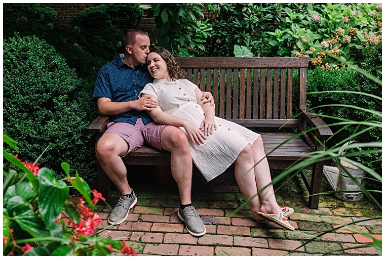 The couple lounges on a bench enjoying a quiet moment together | Laura's Focus Photography