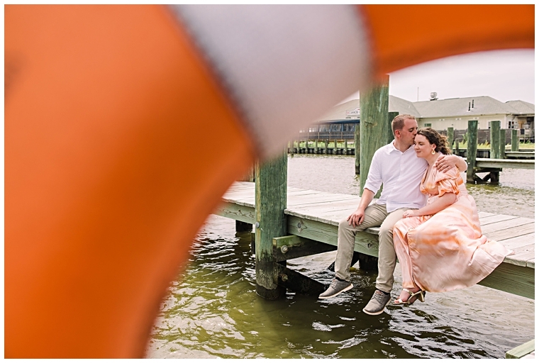 The couple shares a sweet kiss on the dock in Chestertown  | Laura's Focus Photography