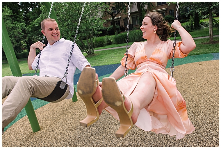 The couple plays on the playground in Chestertown, swinging together | Laura's Focus Photography