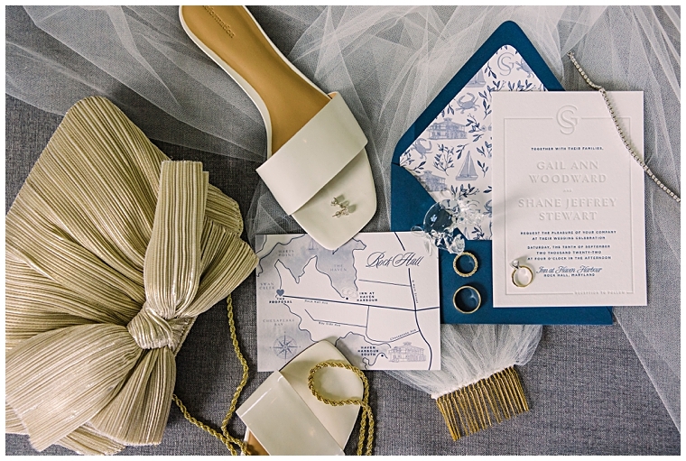 A styled image of the invitation suite with the wedding bands and details of the day | Haven Harbour Marina Resort | Inn at Haven Harbour | Laura's Focus Photography | My Eastern Shore Wedding