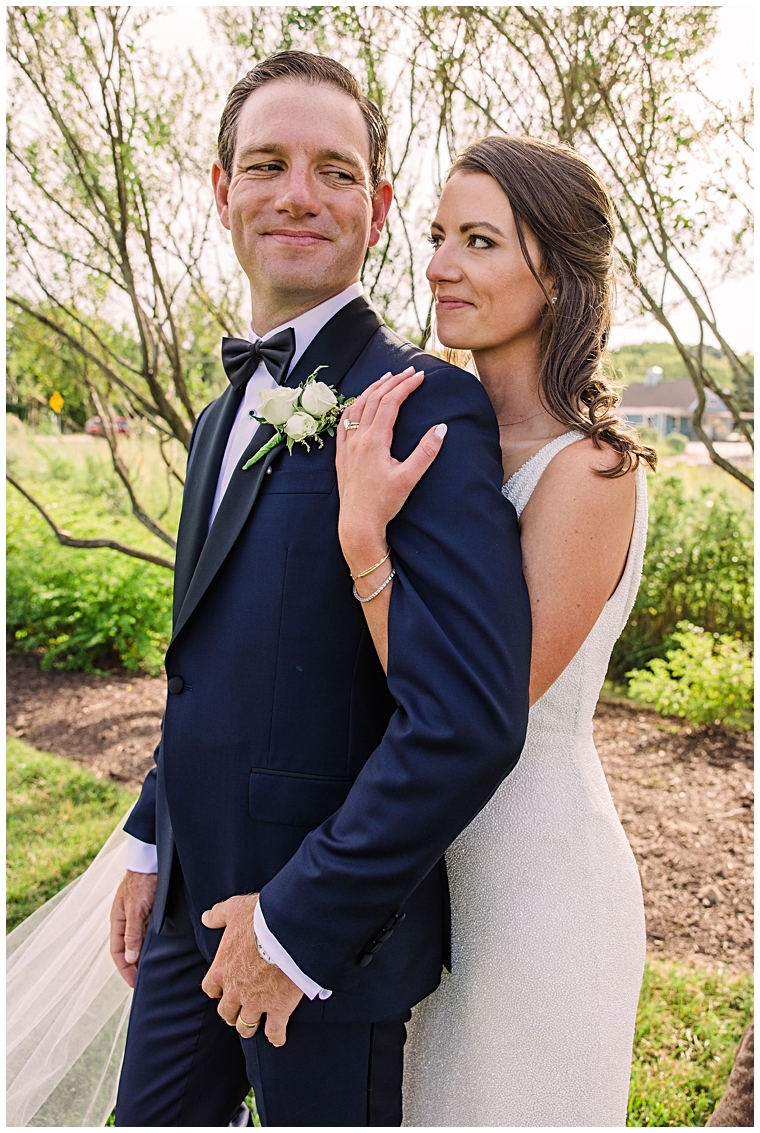 The newlyweds pose for a portrait in the gardens at Haven Harbour Marina Resort | Inn at Haven Harbour | Laura's Focus Photography | My Eastern Shore Wedding