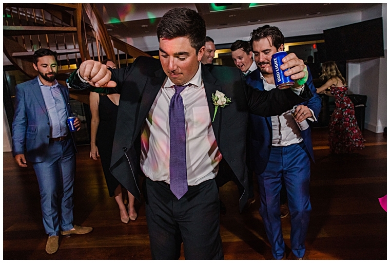 Guests are dancing the night away at the beautiful reception in the Dove and Arc Lounge at Haven Harbour Marina Resort | Inn at Haven Harbour | Laura's Focus Photography | My Eastern Shore Wedding
