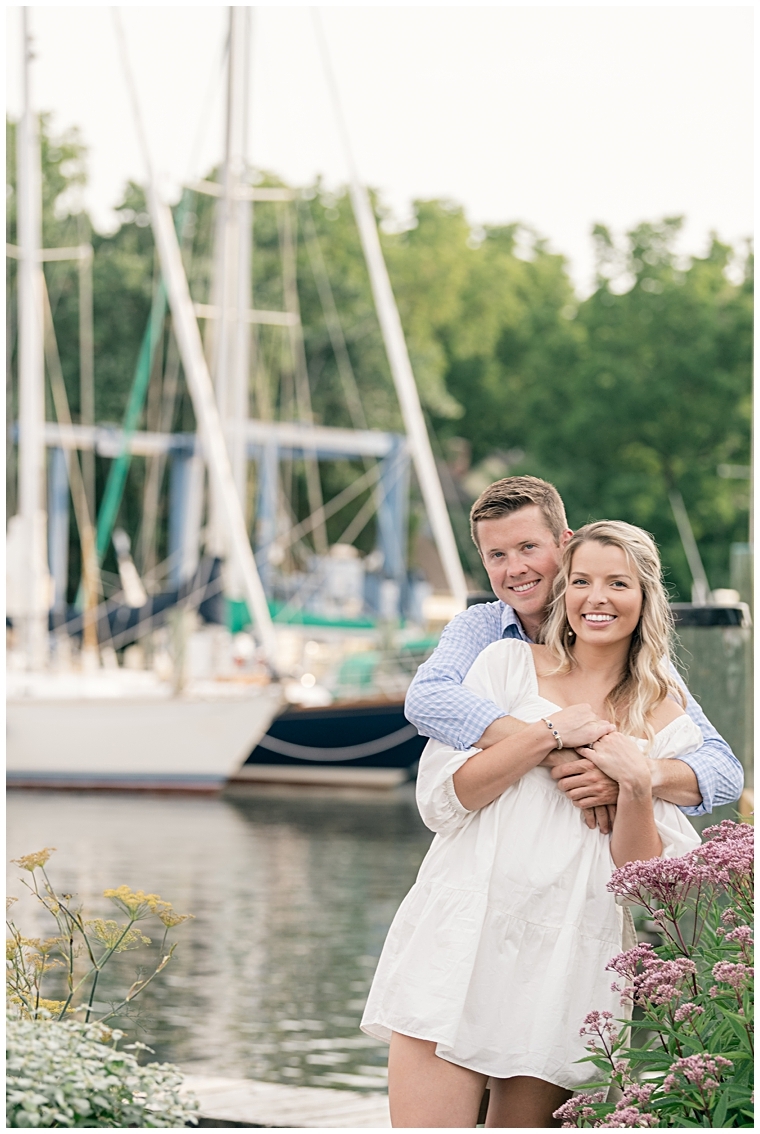 The future groom hugs his bride as they enjoy the views at The Chesapeake Bay Maritime Museum