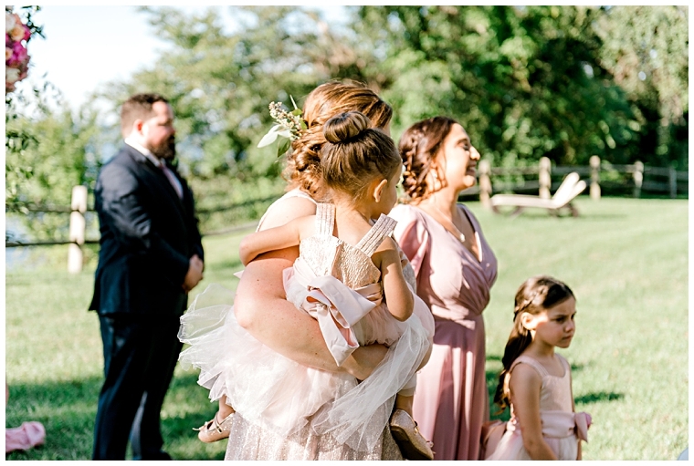 The bridal party celebrates as the bride walks down the aisle to her microwedding ceremony. | My Eastern Shore Wedding